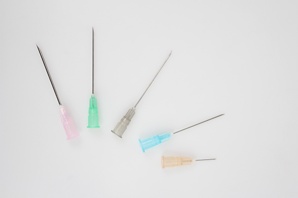 A photo of a row of syringe needles
