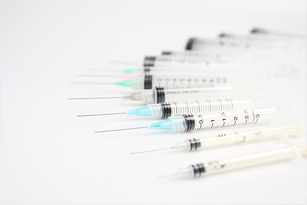 A photo of syringes lined up
